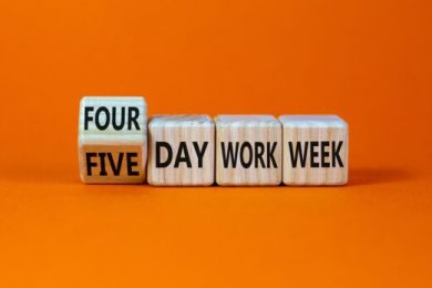 4 or 5 day work week symbol. Turned the cube and changed words ‘five day work week’ to ‘four day work week’. Beautiful orange background. Copy space. Business and 4 or 5 day work week concept.