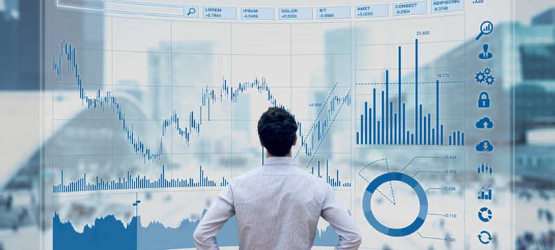 Finance trade manager analysing stock market indicators for best