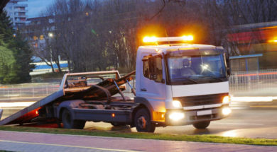 Long exposure shot of a road assistance truck on the boulevard.