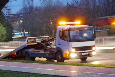 Long exposure shot of a road assistance truck on the boulevard.