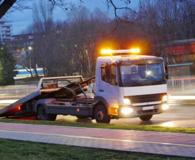 Long exposure shot of a road assistance truck on the boulevard.