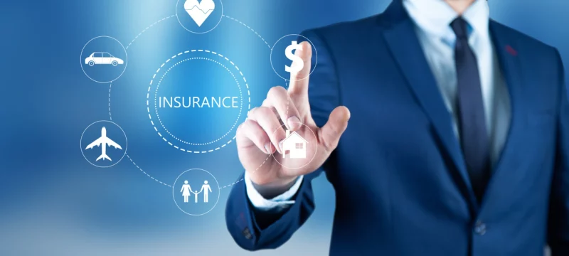 young-business-man-touching-insurance-icon