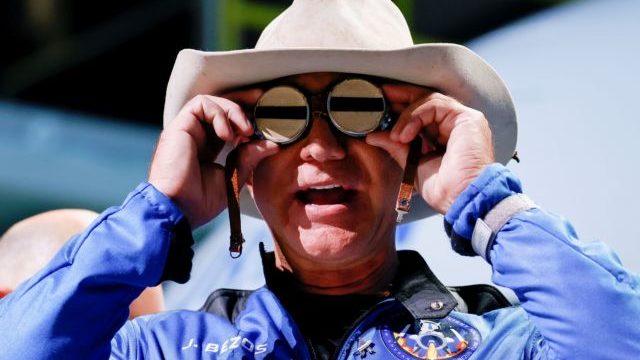 Billionaire American businessman Bezos wears goggles owned by Amelia Earhart which he carried into space at a post-launch press conference after he flew on Blue Origin’s inaugural flight to the edge of space, in Van Horn