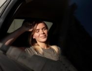 medium-shot-smiley-woman-inside-car_23-2149137197