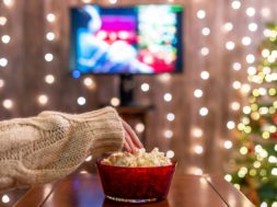 Christmas,Eve.,Alone,Woman,Watching,Tv,And,Eating,Popcorn.,Home