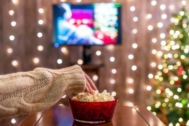 Christmas,Eve.,Alone,Woman,Watching,Tv,And,Eating,Popcorn.,Home